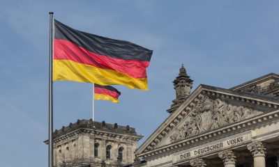 german flag on parliametn building reichstag berlin germany