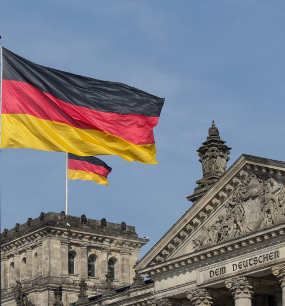 german flag on parliametn building reichstag berlin germany