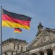 german flag on parliametn building reichstag berlin germany